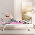 Pink foldable Pilates core bed
